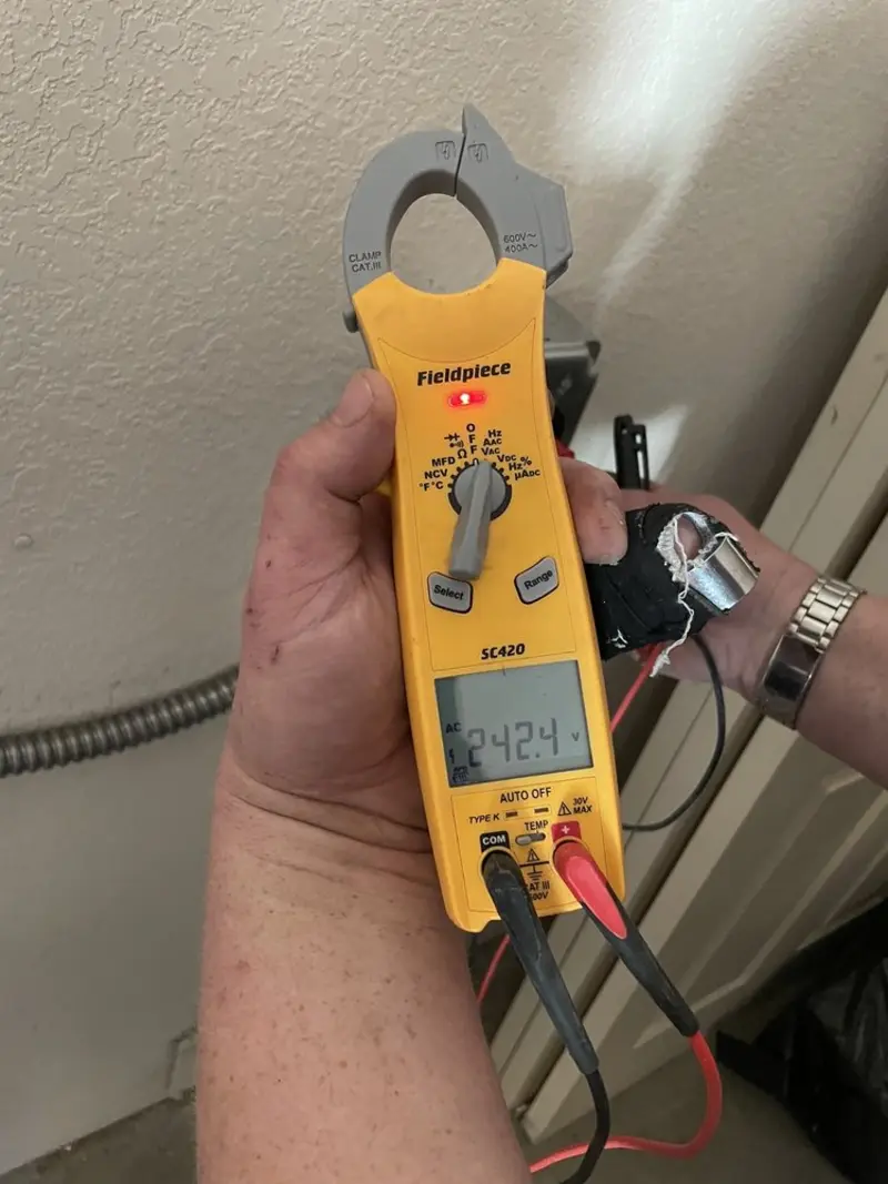 Voltage testing with clamp meter during Whole House Surge Protector in Cranbury